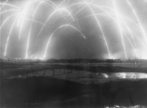 Flares in the night sky over a battlefield during the First World War. Date: 1914-1918